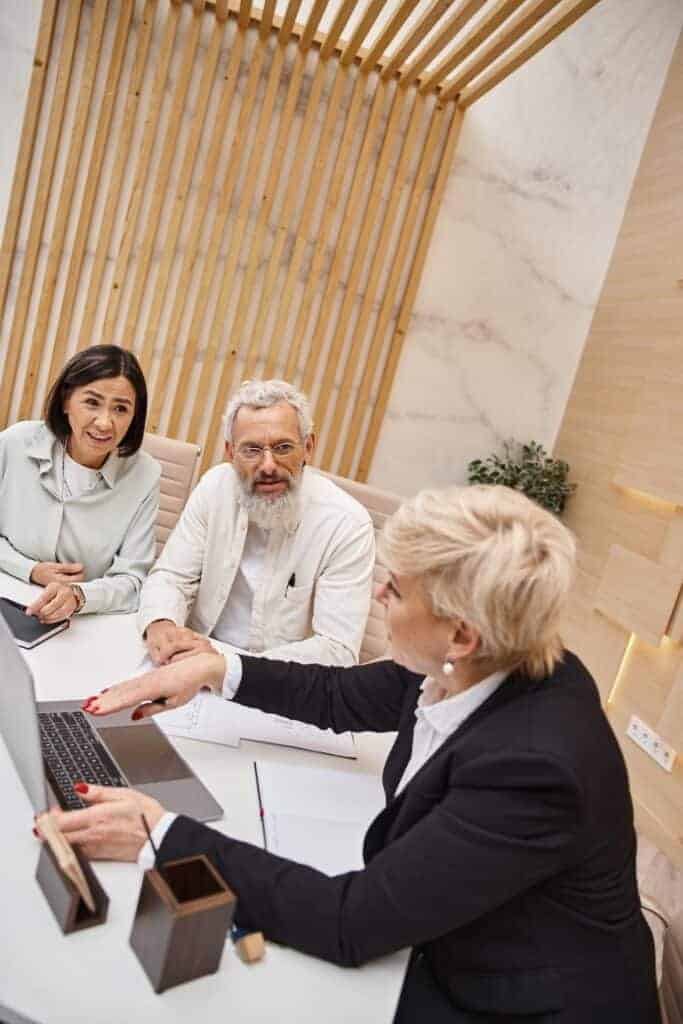 Couple signing Estate Planning documents with a solicitor in Perth, Western Australia. Clairs Keeley Lawyers offering Estate Planning Guide Perth