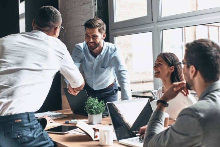 Collaborative Practice in Perth: Business people handshake in agreement at Clairs Keeley Lawyers office, showcasing estate planning and wills.