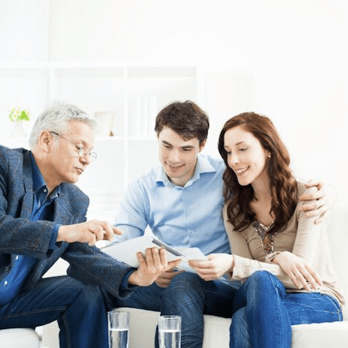 Perth estate planning advisor reviews documents with a couple. Clairs Keeley Lawyers offer advice for wills, estates, & probate in Perth.