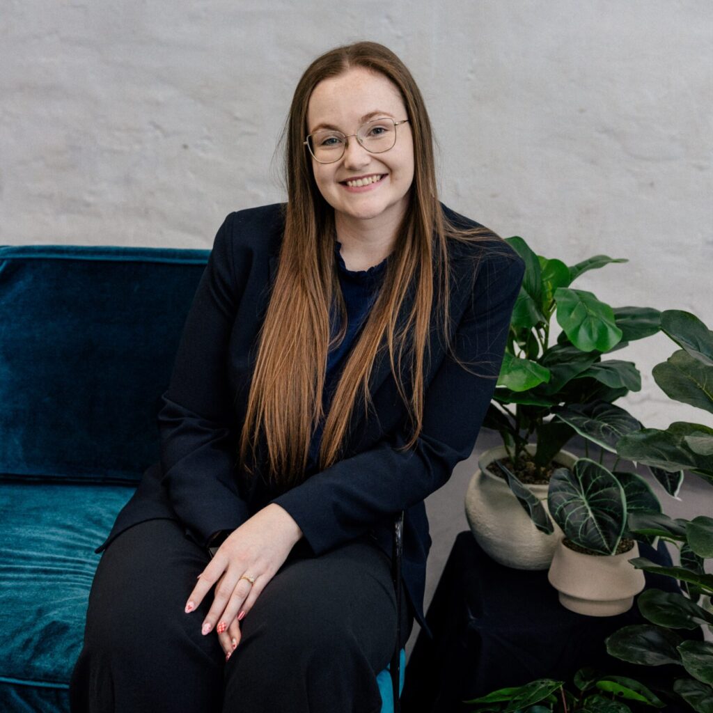 Smiling woman in glasses at Clairs Keeley Lawyers Perth office